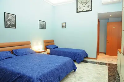 Letto o letti in una camera di Affittacamere Conte Di Cavour