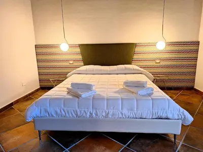 Letto o letti in una camera di Casa Aretusa - Ortigia Holidays
