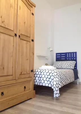 Letto o letti in una camera di Alloggio Lentini