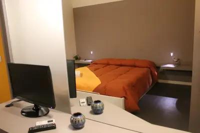 Letto o letti in una camera di Specula Domus - Ibla