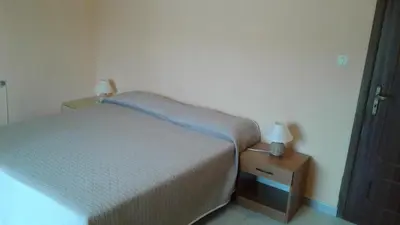 Letto o letti in una camera di villa gio con piscina