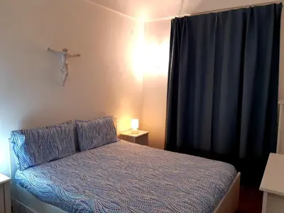 Letto o letti in una camera di Elegante appartamento in palazzo storico Ortigia