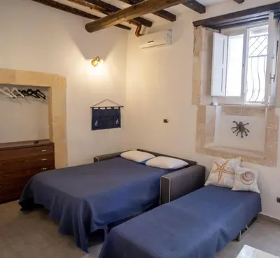 Letto o letti in una camera di La casetta del pescatore