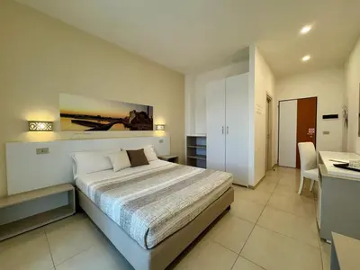 Letto o letti in una camera di Hotel Jonio