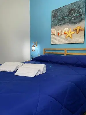 Letto o letti in una camera di SyracuseApartments IL PASUBIO di SIRACUSA Stupendo appartamento vicino ad ORTIGIA a 200m dal MARE