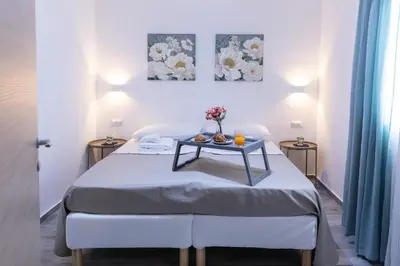 Letto o letti in una camera di Villa Pasitea fronte mare