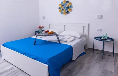 Letto o letti in una camera di Villa Pasitea fronte mare