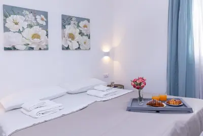 Letto o letti in una camera di Villa Pasitea fronte mare