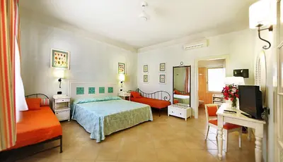 Letto o letti in una camera di iGV Club Marispica