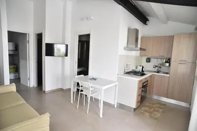 Cucina o angolo cottura di Appartamento con piscina Oasi 2