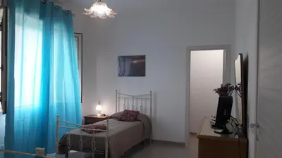Letto o letti in una camera di Casa Le Pigne