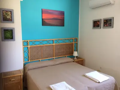 Letto o letti in una camera di Hotel Il Triangolo