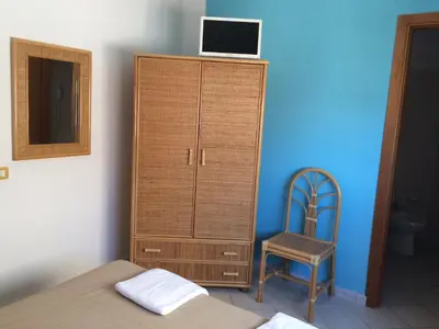 Letto o letti in una camera di Hotel Il Triangolo