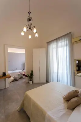 Letto o letti in una camera di Palazzo Bruca Catania