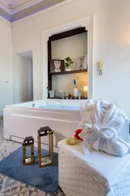 Letto o letti in una camera di Palazzo Bruca Catania