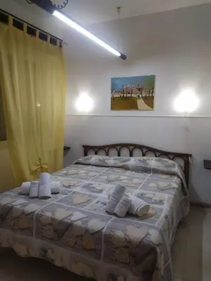 Letto o letti in una camera di Villa al Plemmirio