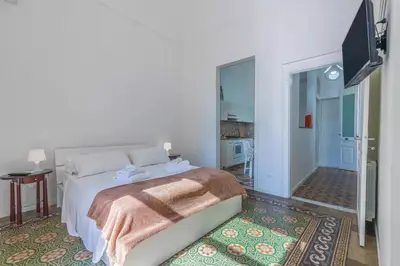 Letto o letti in una camera di Hotiday Siracusa A'Storia