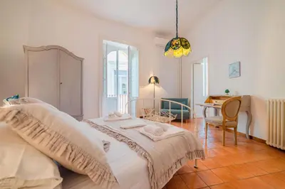 Letto o letti in una camera di Ortigia ART & DesiGn, Parking , Smartworking