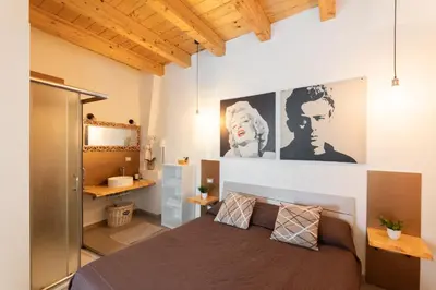 Letto o letti in una camera di Dolce Rame Ortigia