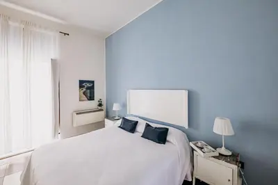Letto o letti in una camera di Kyanos Residence