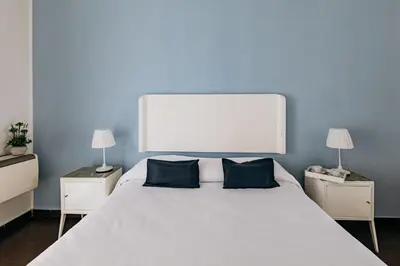 Letto o letti in una camera di Kyanos Residence