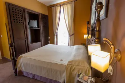 Letto o letti in una camera di Hotel dei Coloniali