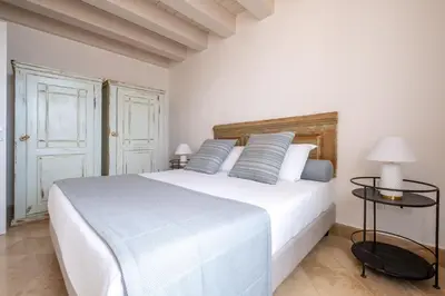 Letto o letti in una camera di Palazzo Alfeo Aparthotel