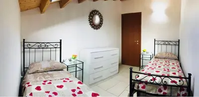 Letto o letti in una camera di Villa Maddy