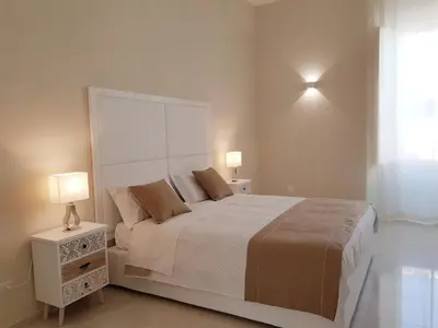 Letto o letti in una camera di B&B Via Cavour 32