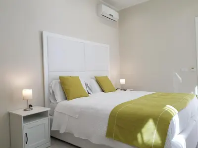 Letto o letti in una camera di B&B Via Cavour 32