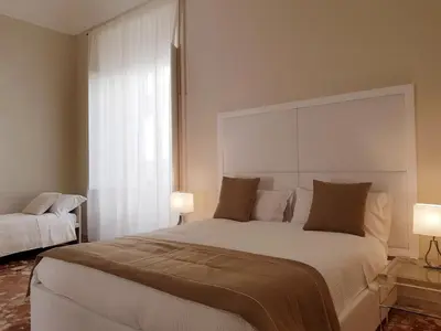 Letto o letti in una camera di B&B Via Cavour 32