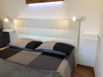 Letto o letti in una camera di Attico Teatro Greco