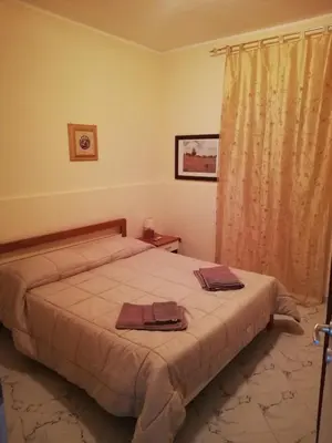 Letto o letti in una camera di Villa Gallina
