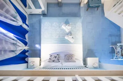 Letto o letti in una camera di QuattroCuori Boutique Hotel & Spa