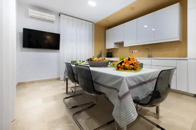 TV o dispositivi per l'intrattenimento presso Porta Reale Beach Apartment