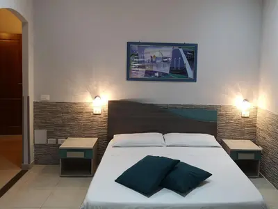 Letto o letti in una camera di B&B AMURI RANNI