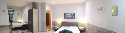 Letto o letti in una camera di B&B AMURI RANNI