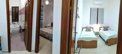 Letto o letti in una camera di B&B AMURI RANNI