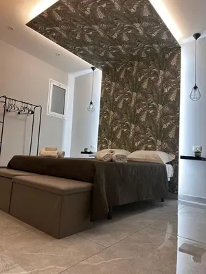 Letto o letti in una camera di Dimora Vittorio Emanuele 392