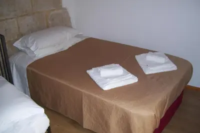 Letto o letti in una camera di La Dimora di Angela