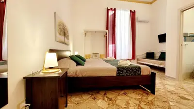 Letto o letti in una camera di Zanzi 's Charming Rooms