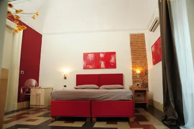 Letto o letti in una camera di Sangiuliano114 B&B
