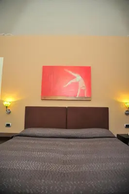 Letto o letti in una camera di Sangiuliano114 B&B