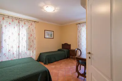 Letto o letti in una camera di Apollo B&B