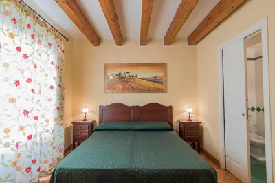 Letto o letti in una camera di Apollo B&B