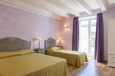 Letto o letti in una camera di B&B Apollo