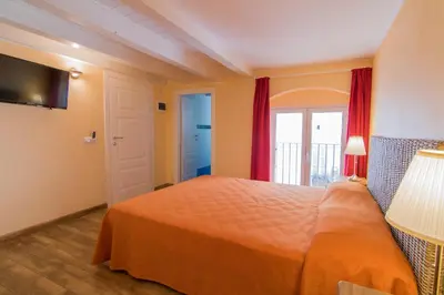 Letto o letti in una camera di B&B Apollo