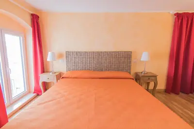 Letto o letti in una camera di B&B Apollo