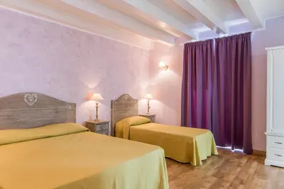 Letto o letti in una camera di B&B Apollo