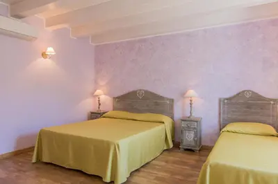 Letto o letti in una camera di B&B Apollo